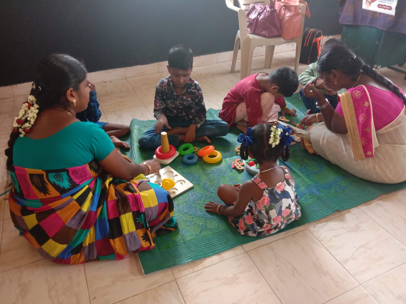 Children and caregivers doing learning activities together